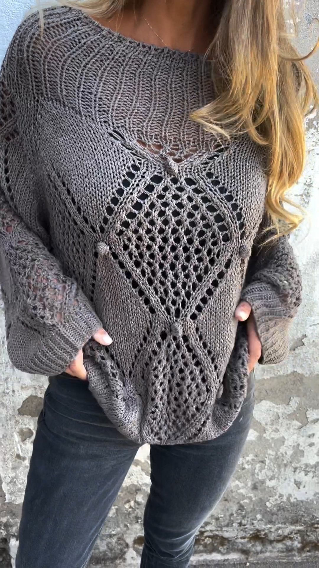 Knitted sweater with a round neckline