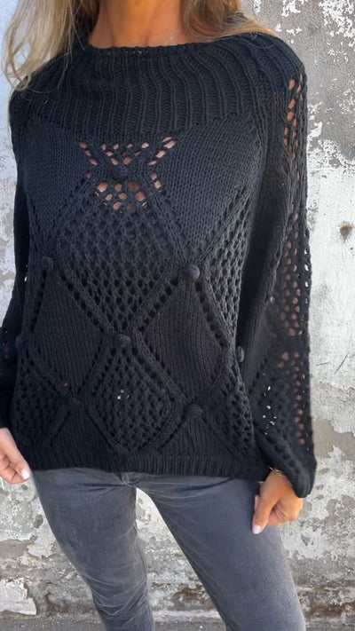 Knitted sweater with a round neckline