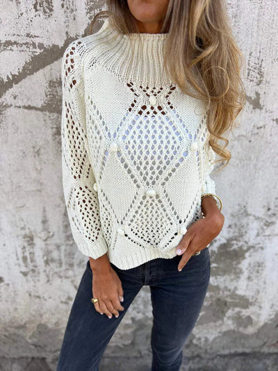 Knitted sweater with a round neckline