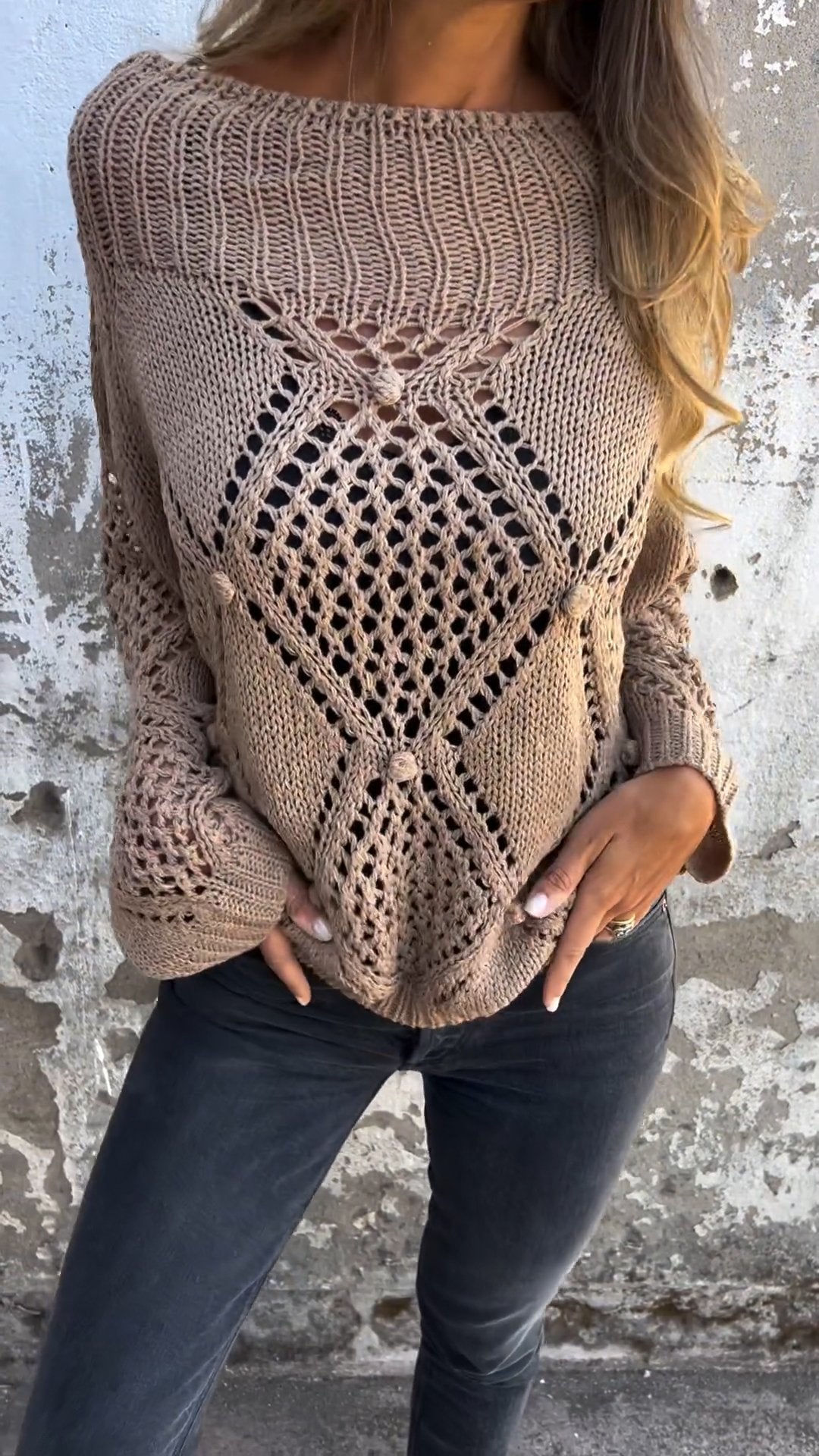 Knitted sweater with a round neckline