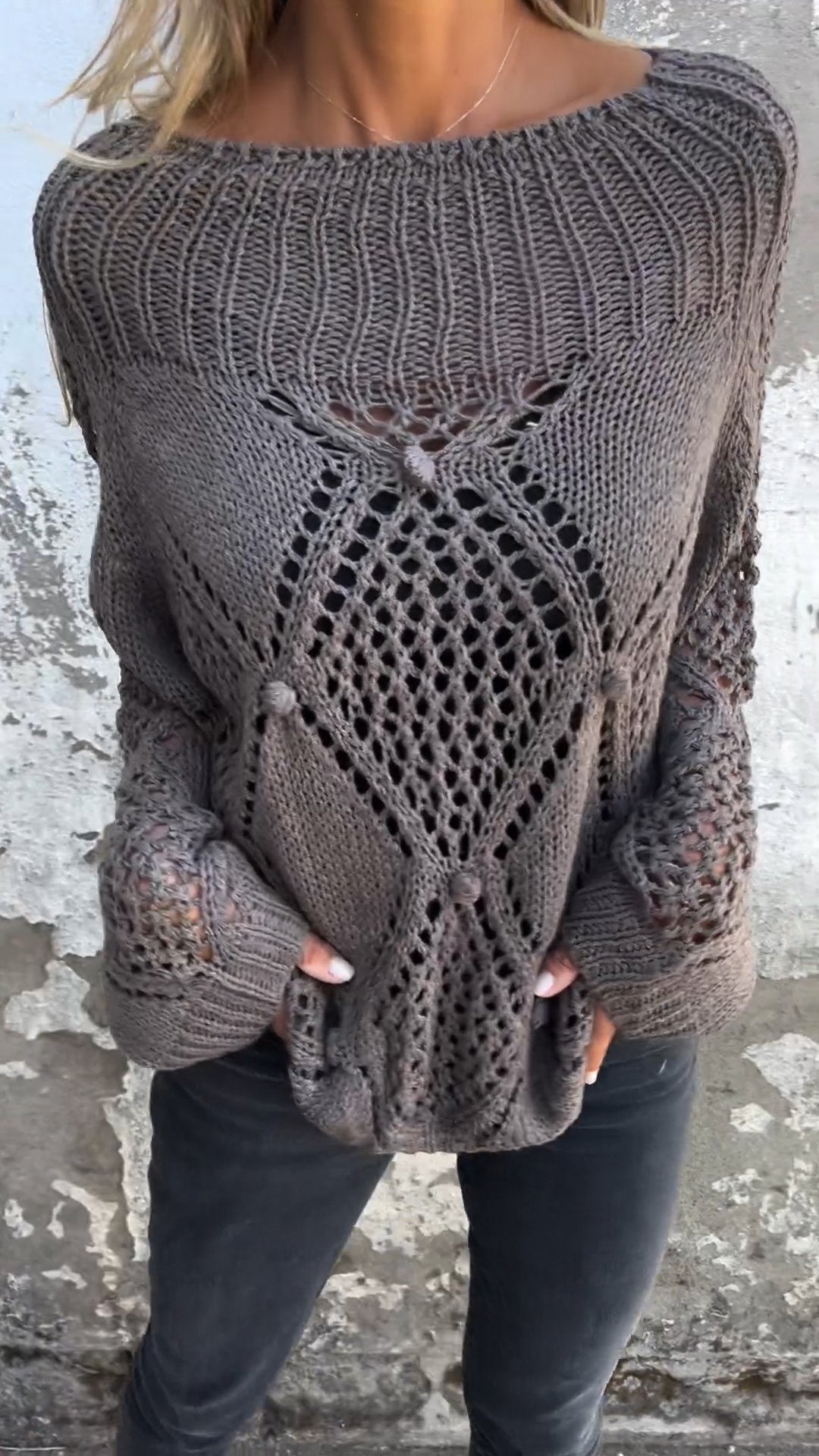 Knitted sweater with a round neckline