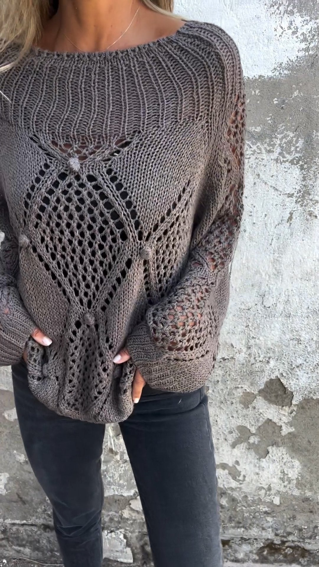 Knitted sweater with a round neckline